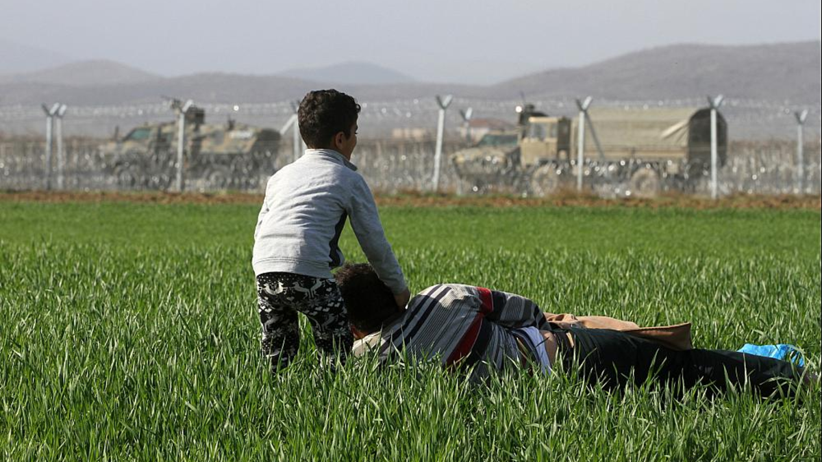 FlÃ¼chtlinge vor dem mazedonischen Grenzzaun - Foto: über dts Nachrichtenagentur