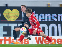 Freiburgs Lukas Kübler (r) im Kopfballduell mit Frankfurts Doppeltorschützen Ansgar Knauff. - Foto: Tom Weller/dpa