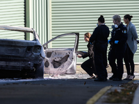 Forensische Polizeieinheiten sichern am Tatort in Sydney Spuren. - Foto: Bianca De Marchi/AAP/dpa