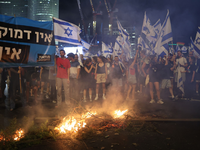 Israel: Menschen protestieren gegen die Pläne der Regierung zur Umgestaltung des Justizsystems. - Foto: Ilia Yefimovich/dpa