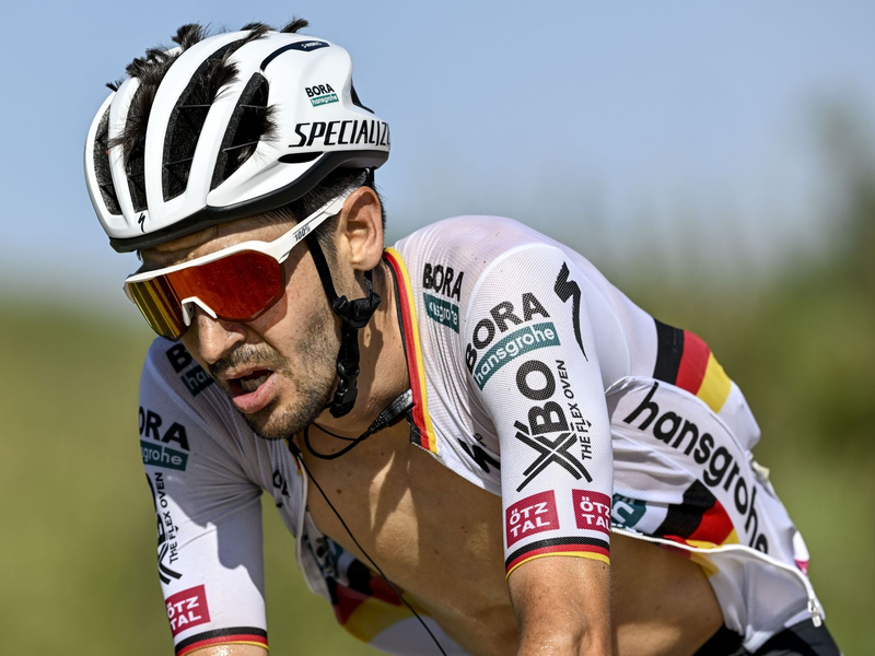 Leistet bei der Tour wichtige Helferdienste für Jai Hindley: Emanuel Buchmann. - Foto: Dirk Waem/Belga/dpa