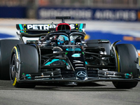 Mit dem Sieg in Singapur betrieb Russell auch noch mal Werbung in eigener Sache. (Archivbild) - Foto: Vincent Thian/AP/dpa