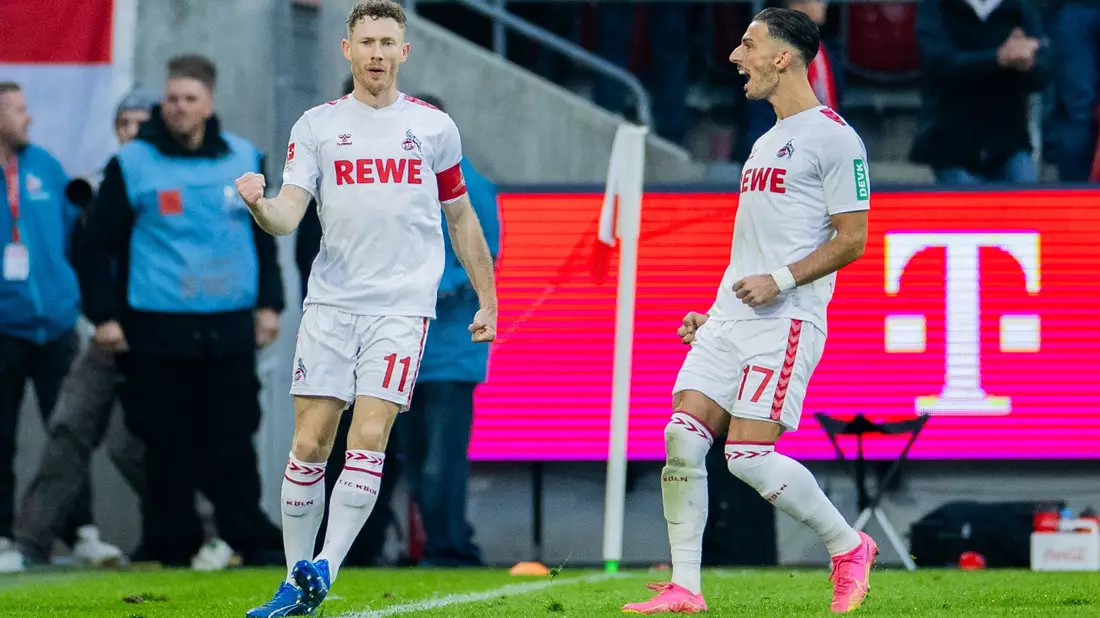 Leart Paqarada (r) und Florian Kainz bejubeln einen Kölner Treffer. - Bild: Rolf Vennenbernd/dpa