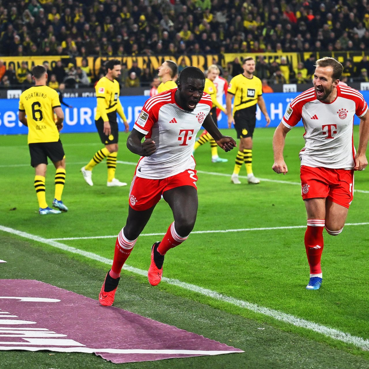 Dayot Upamecano (l) brachte die Bayern in Dortmund früh in Führung. - Foto: Bernd Thissen/dpa