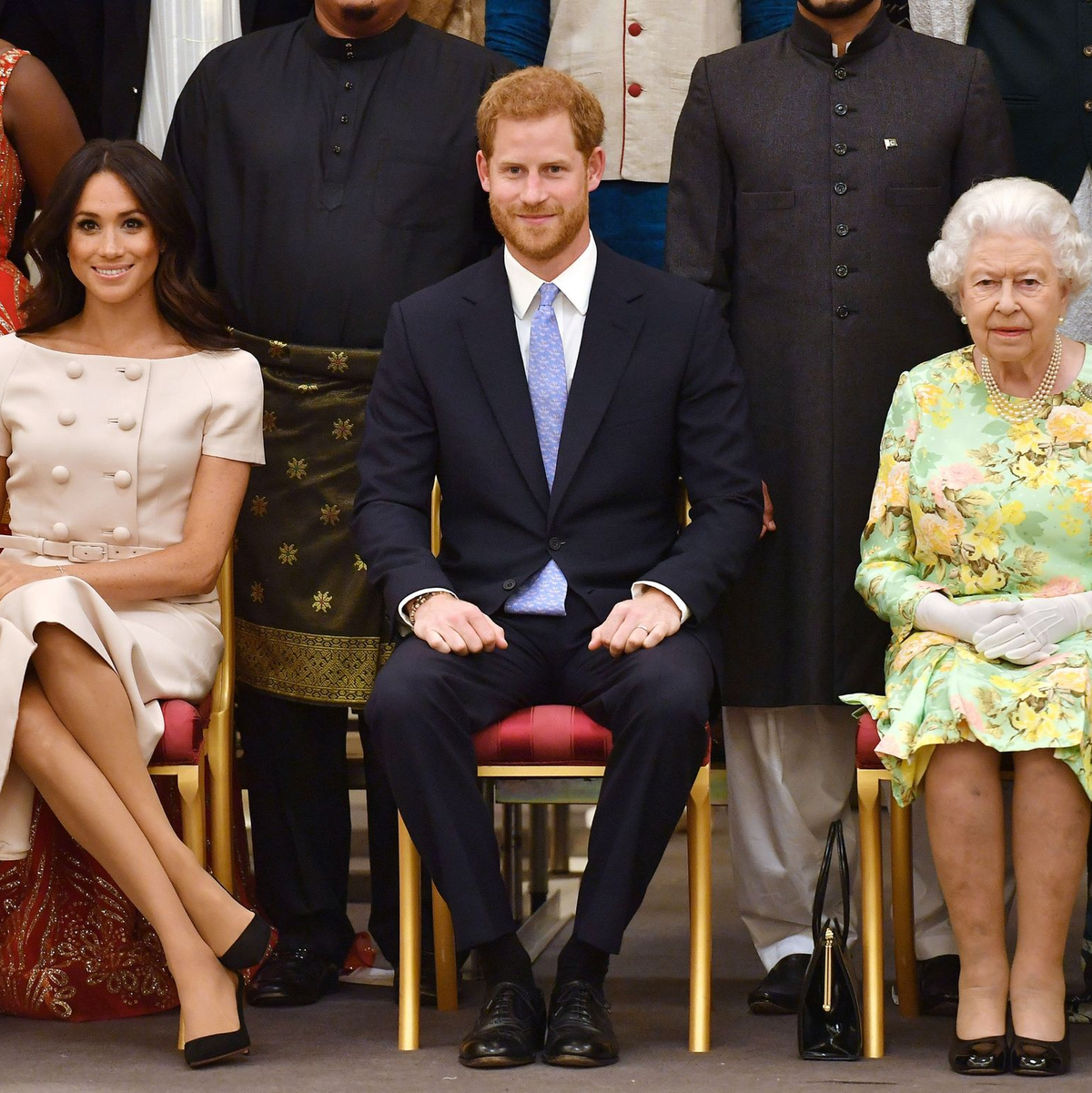 Die britische Königin Elizabeth II., Prinz Harry und seine Frau Meghan auf einer Aufnahme aus dem Sommer 2018. - Foto: John Stillwell/PA Wire/dpa