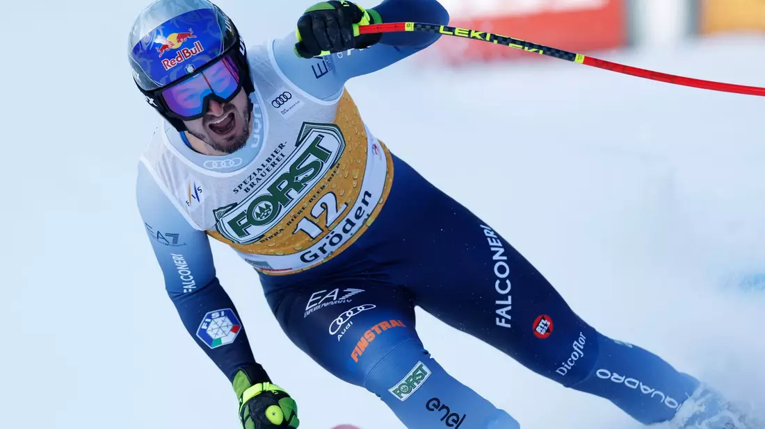Der Italiener Dominik Paris jubelt im Ziel. - Bild: Alessandro Trovati/AP