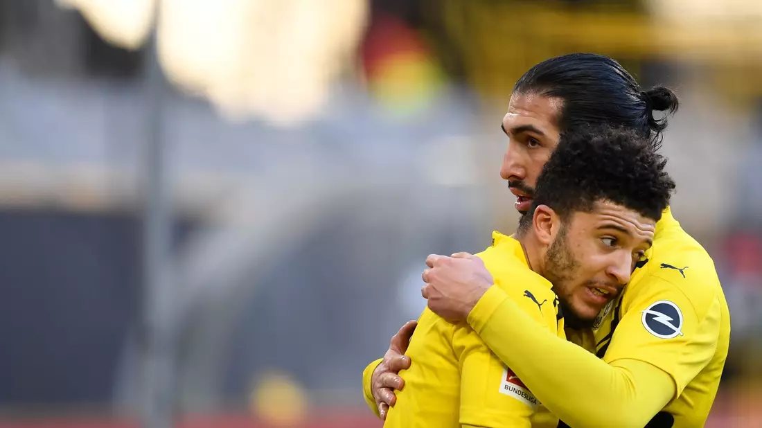 Emre Can (r) wünscht sich eine Rückkehr von Jadon Sancho zum BVB. - Bild: Marius Becker/dpa