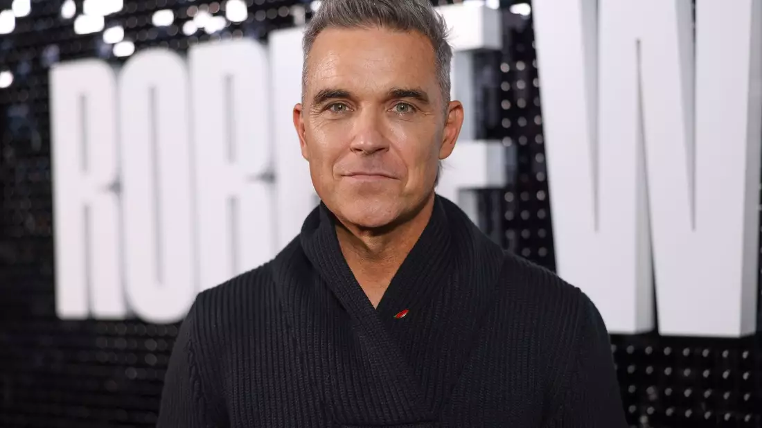 Robbie Williams feiert seinen 50. Geburtstag. - Bild: Vianney Le Caer/AP/dpa