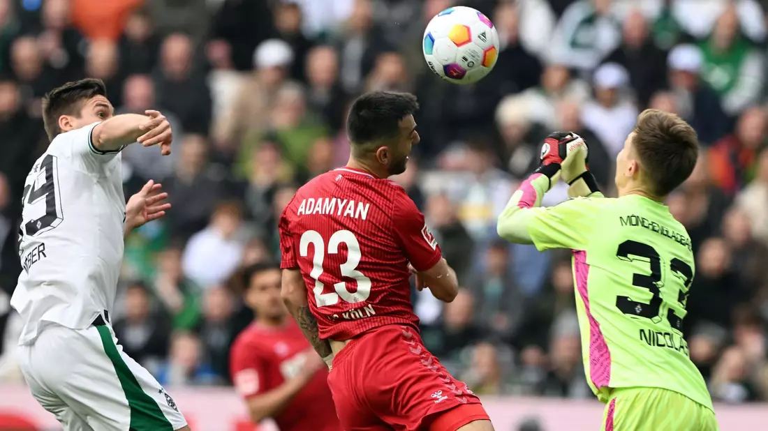 Sargis Adamyan (M) und der 1. FC Köln nehmen einen Punkt aus Mönchengladbach mit. - Bild: Federico Gambarini/dpa