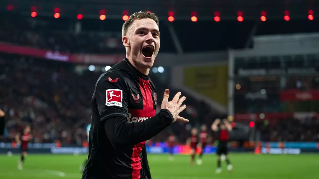 Florian Wirtz (M) will künftig mit dem FC Liverpool Titel gewinnen. - Bild: Marius Becker/dpa