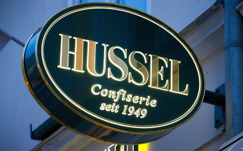 Das Logo der Confiserie «Hussel». - Foto: Stefan Sauer/dpa-Zentralbild/dpa