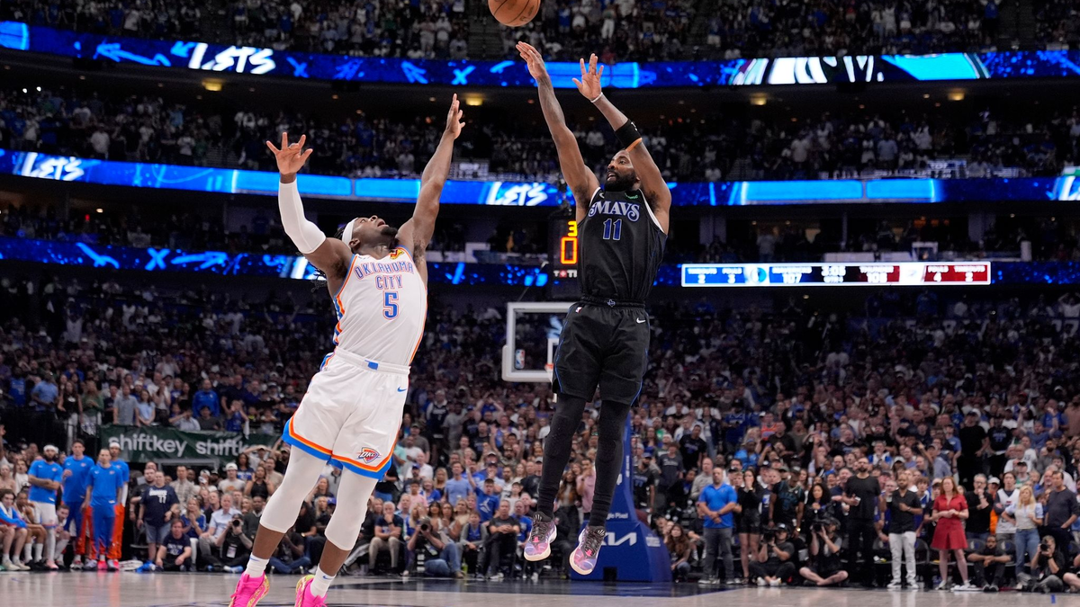 Oklahomas Luguentz Dort (5) kann den Wurf von Mavericks-Guard Kyrie Irving nicht verhindern. - Foto: Tony Gutierrez/AP