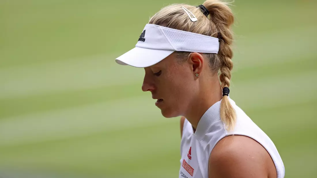 Um auf dem heiligen Rasen zu glänzen, muss Angelique Kerber so einiges abschütteln. - Bild: Steven Paston/PA Wire/dpa