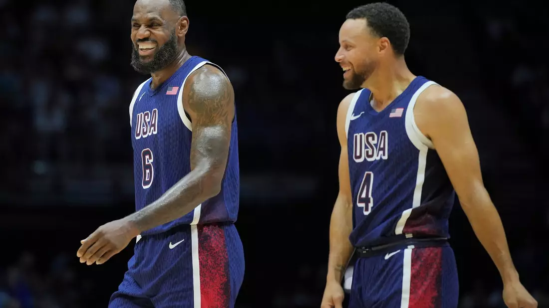Laufen für die USA auf: NBA-Superstar James und Curry. - Bild: Kin Cheung/AP/dpa