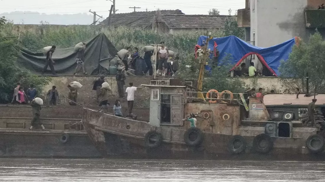 Regenmassen bedrohen Ernte in Nordkorea - Bild: Kyodo/dpa
