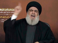 Hisbolllah-FĂŒhrer Hassan Nasrallah spricht ĂŒber eine Videoverbindung wĂ€hrend einer Kundgebung in Beirut. - Foto: Uncredited/AP/dpa