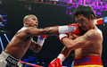 Im Juni 2015 flogen erstmals die Fäuste zwischen Floyd Mayweather (l) und Manny Pacquiao. (Archivbild) - Foto: John Locher/AP/dpa