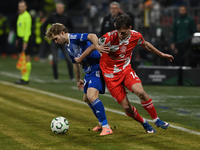 Der FSV Mainz 05 um William Bøving (r) lieferte sich ein umkämpftes Duell mit Sigma Olmütz. - Foto: Ludìk Peøina/CTK/dpa