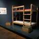 Oder ein Bett aus einer 2015 eingerichteten Flüchtlingsunterkunft. - Foto: Sven Kaeuler/dpa