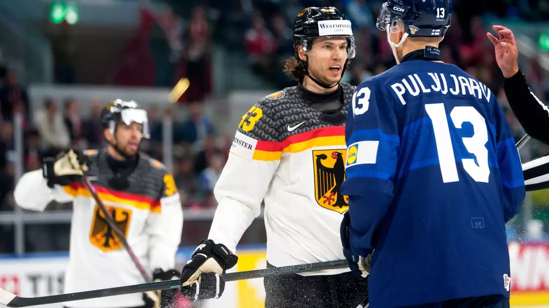 Kapitän Moritz Seider im Wortgefecht mit NHL-Kollege Jesse Puljujarvi. - Bild: Claudio Thoma/KEYSTONE/dpa