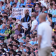 Die Fans würdigten ihren Erfolgscoach Pep Guardiola zum Abschied mit Transparenten. - Foto: Martin Rickett/PA Wire/dpa