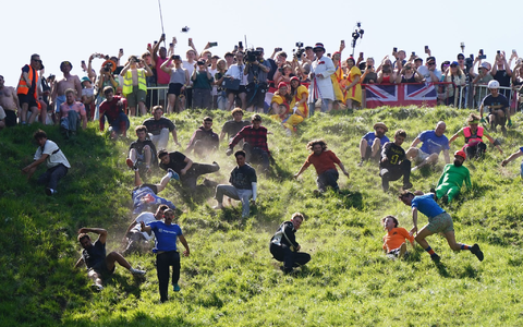 Das Käserennen in England hat Tradition.  - Foto: Jacob King/PA Wire/dpa