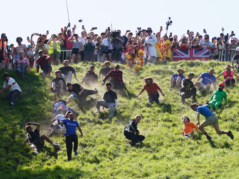 Das Käserennen in England hat Tradition.  - Foto: Jacob King/PA Wire/dpa