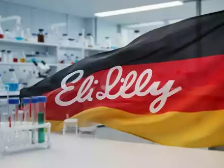 Eine deutsche Flagge, die sich teilweise zurückzieht, mit dem angedeuteten Eli Lilly Logo, vor einem unscharfen Laborhintergrund. - Foto: über boerse-global.de