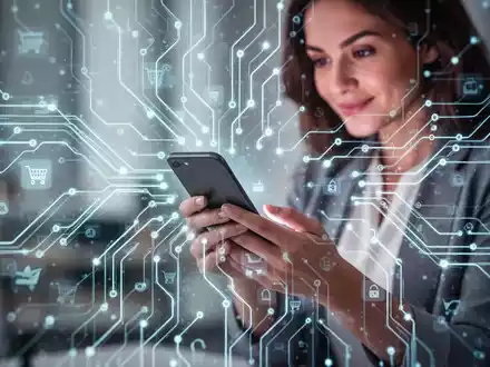 Abstract representation of AI and e-commerce with a glowing neural network pattern over a blurred image of a woman shopping on a smartphone. - Foto: über boerse-global.de
