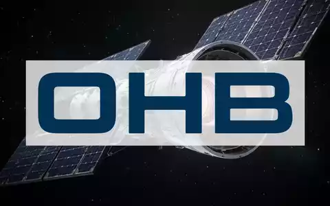 Ein stilisiertes, hochtechnologisches Satelliten- oder Raketenbauteil mit subtilem Leuchten vor einem dunklen Sternenhimmel. - Foto: über boerse-global.de