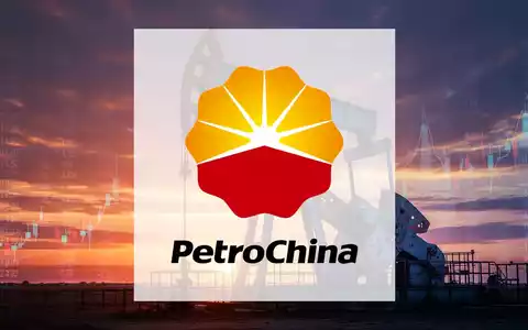 Eine stilisierte Ölplattform vor einem dramatischen Sonnenuntergang mit subtilen Finanzmarktdaten am Horizont. - Foto: über boerse-global.de