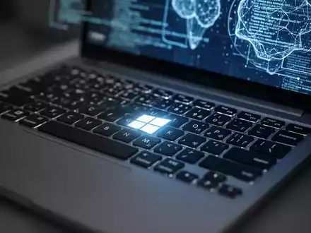 A close-up of a laptop keyboard with a glowing Windows key, an abstract interface on the screen, symbolizing technology and updates. - Foto: über boerse-global.de