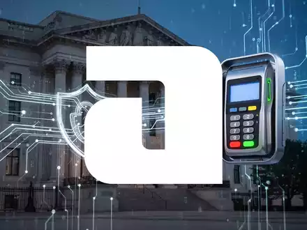 Abstrakte Darstellung digitaler Zahlungsvorgänge, die eine Regierungsfassade mit einem Zahlungsterminal-Symbol verbinden. - Foto: über boerse-global.de