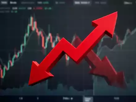 Ein roter, scharf nach unten zeigender Pfeil symbolisiert einen starken Aktienkursrückgang vor einem unscharfen Börsenchart. - Foto: über boerse-global.de