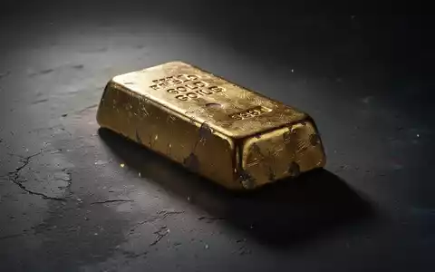 Ein schwerer Goldbarren liegt auf einer dunklen Oberfläche, umgeben von Schatten, was Spannung und Druck andeutet. - Foto: über boerse-global.de