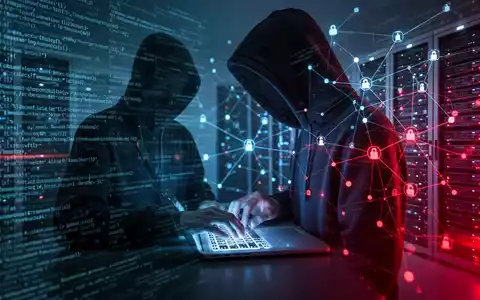 A person in a hoodie typing on a laptop, surrounded by abstract digital code and server racks, symbolizing cybersecurity threats. - Foto: über boerse-global.de