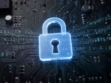 A glowing blue padlock icon superimposed on a dark, intricate circuit board with subtle binary code, symbolizing digital security and vulnerabilities. - Foto: über boerse-global.de