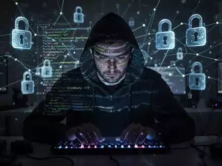 A shadowy figure typing on a keyboard, with digital code and network lines overlaying the scene, representing cyber warfare. - Foto: über boerse-global.de