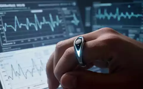 Ein Nahaufnahme eines modernen, ringförmigen Wearables am Finger, mit unscharfen medizinischen Diagrammen im Hintergrund. - Foto: über boerse-global.de