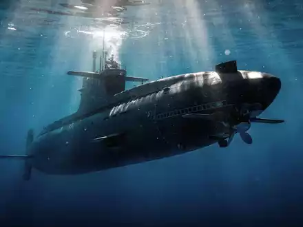 Ein modernes U-Boot gleitet unter Wasser, mit Sonnenlicht, das durch die Oberfläche bricht. - Foto: über boerse-global.de