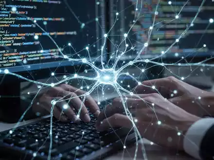 A stylized neural network diagram overlaid on hands typing code on a laptop, symbolizing AI coding tools. - Foto: über boerse-global.de