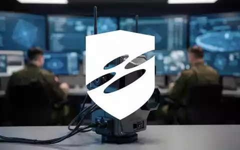 Ein modernes Drohnenabwehrsystem mit Antennen und Sensoren im Vordergrund, unscharfer Hintergrund eines Militärkommandostandes. - Foto: über boerse-global.de