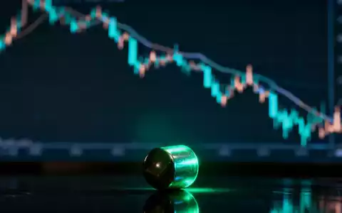Ein glühendes Uranpellet auf dunklem Untergrund, im Hintergrund ein unscharfer Börsenchart mit Abwärtstrend. - Foto: über boerse-global.de