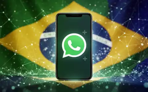 A smartphone screen showing the WhatsApp logo with a 'plus' symbol, set against a colorful, abstract background suggesting Brazil. - Foto: über boerse-global.de