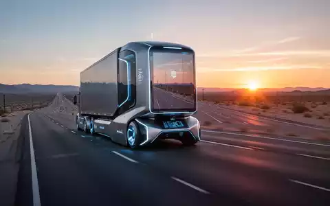 A futuristic, self-driving semi-truck on a highway at dawn, with a vibrant sunrise on the horizon. - Foto: über boerse-global.de
