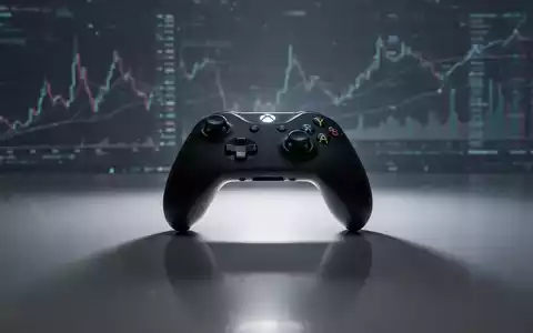 An Xbox controller sits on a reflective surface, with blurred financial charts and data in the background, symbolizing strategic business decisions for the gaming division. - Foto: über boerse-global.de