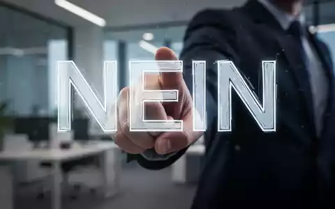Eine Hand schiebt das Wort „NEIN“ weg, im Hintergrund ein unscharfes Büro. Symbolisiert das Setzen von Grenzen und Resilienz. - Foto: über boerse-global.de