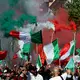 Der Protest steht dem Motto «Remigration und Rückeroberung».  - Bild: Marco Iacobucci/SOPA Images via ZUMA Press Wire/dpa