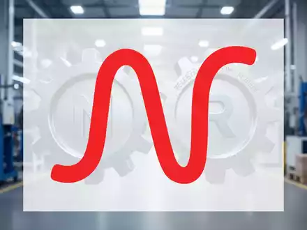 Zwei Zahnräder greifen ineinander, symbolisieren eine Übernahme, mit stilisierten Buchstaben N und R. Hintergrund ist eine Fabrikhalle. - Foto: über boerse-global.de