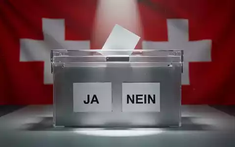 Eine Nahaufnahme einer modernen Wahlurne mit den Optionen «JA» und «NEIN», die eine demokratische Abstimmung in der Schweiz symbolisiert. - Foto: über boerse-global.de